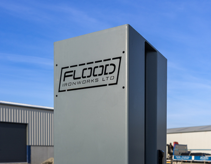 A grey tower with the 'Flood Ironworks LTD' sign in black.